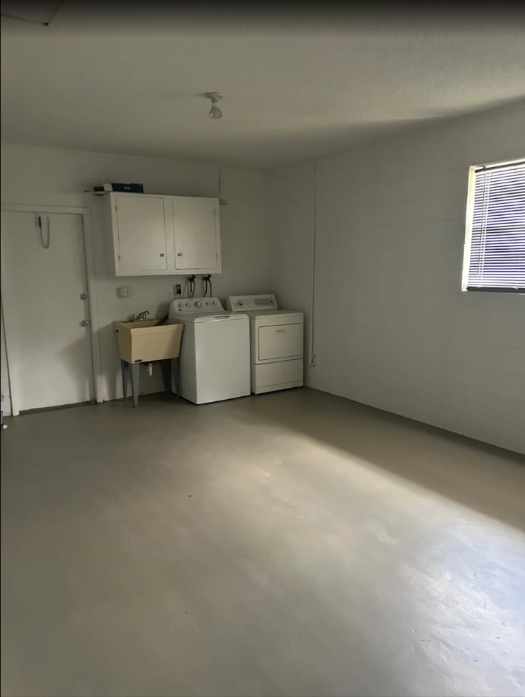Garage with freshly painted walls and an epoxy-coated concrete floor in Ocala, FL